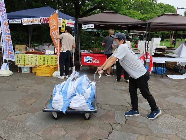 Transporting sandbags to secure tent poles